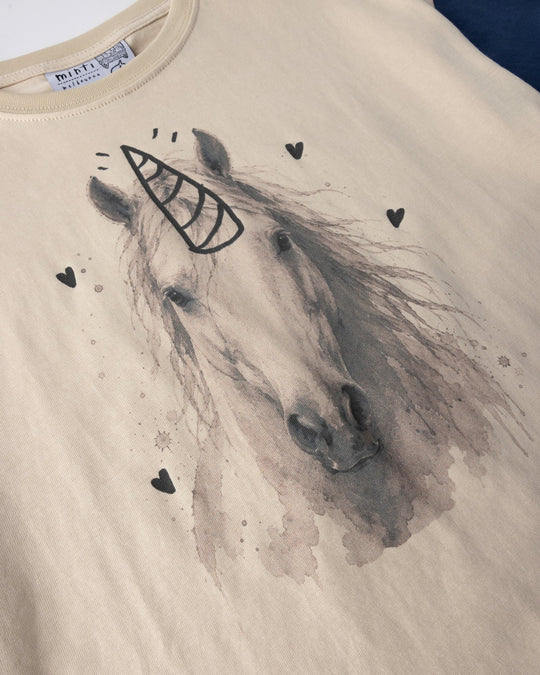 Close up of the Watercolour Unicorn Tee print in stone and midnight