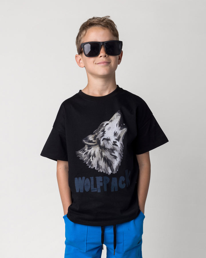 Close up of the Wolfpack Tee in black on a kid, front view