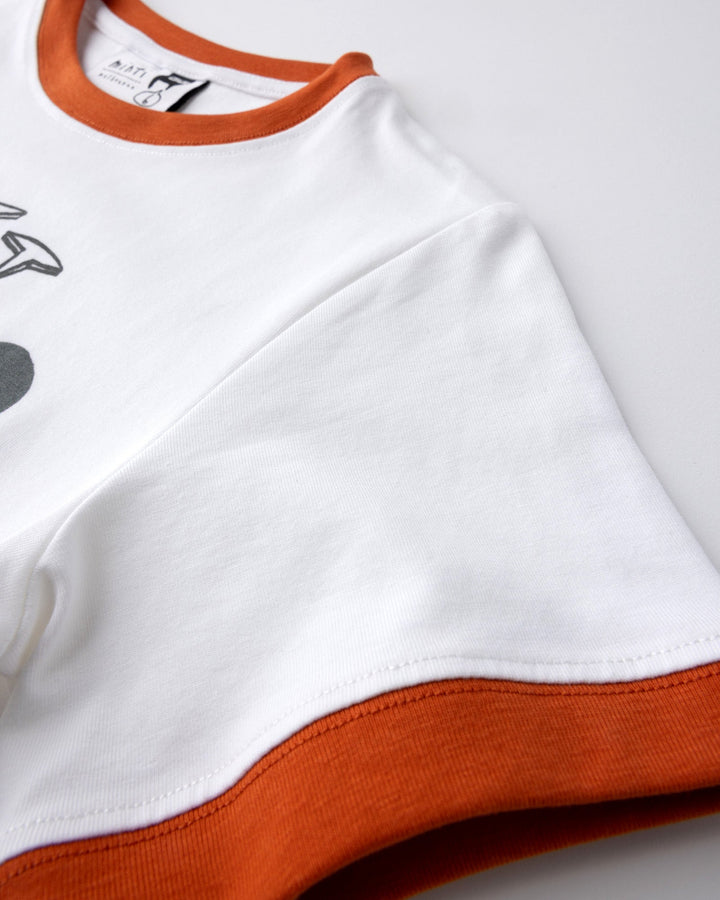 Close up detail of the Fast Panda Tee in white and orange
