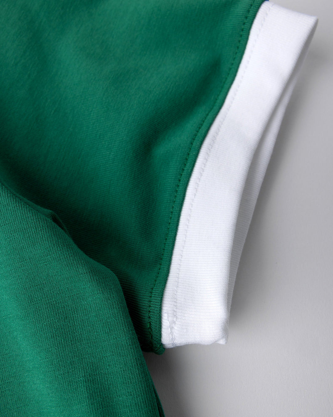 Close up detail of the Flower Party Tee in kelly green and white