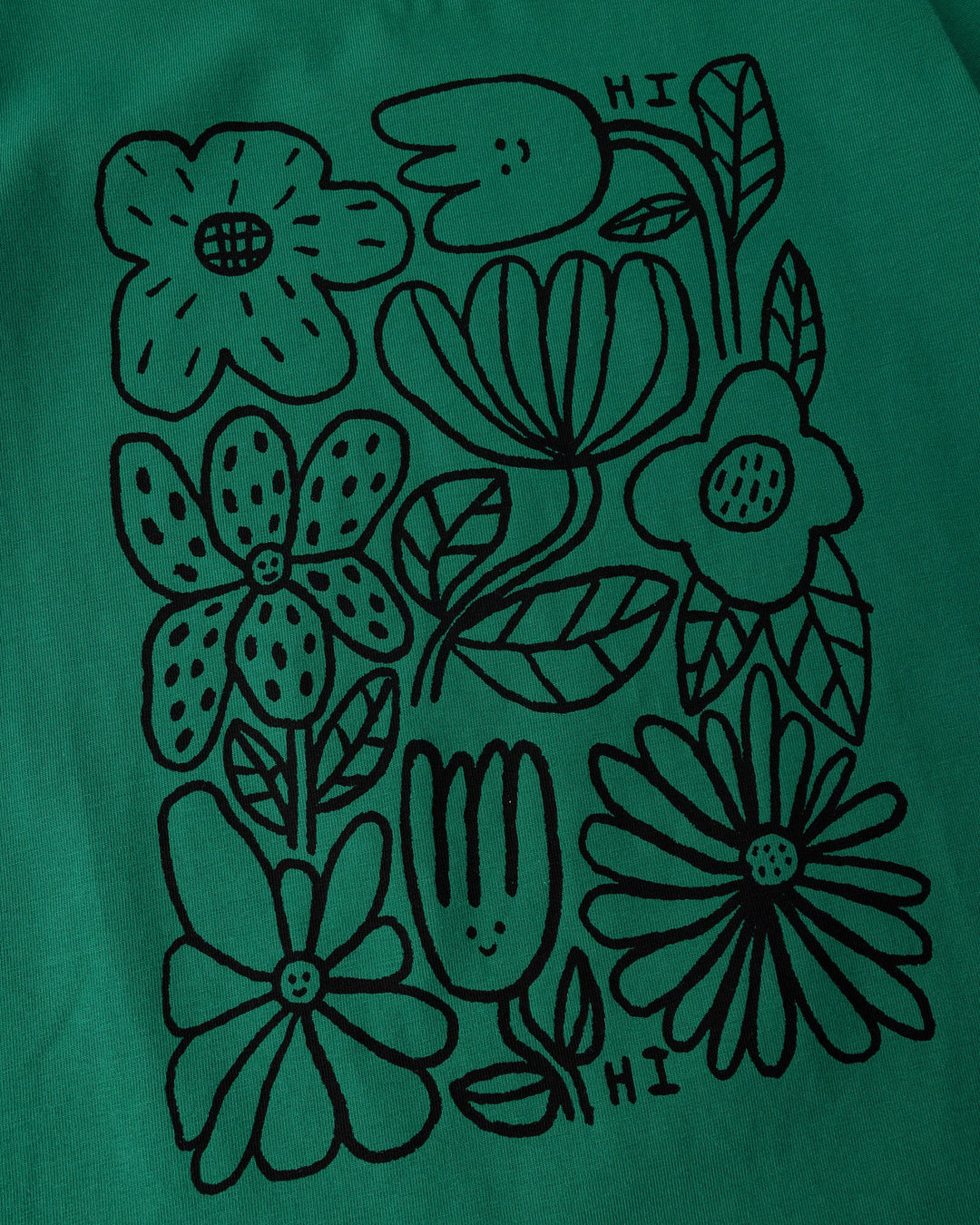 Close up of the Flower Party Tee print in kelly green and white
