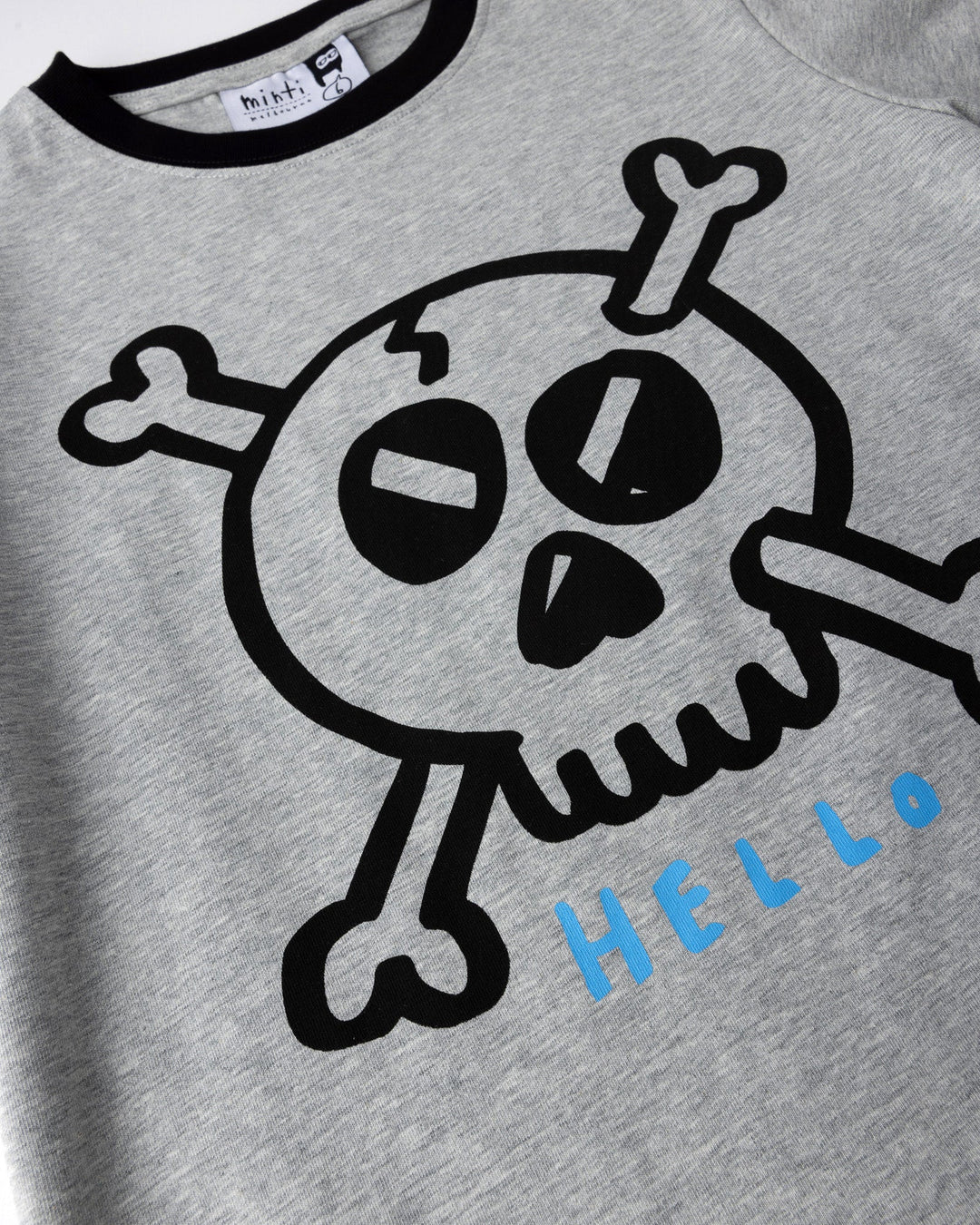Close up of the Hello Skull Tee print in grey marle and black
