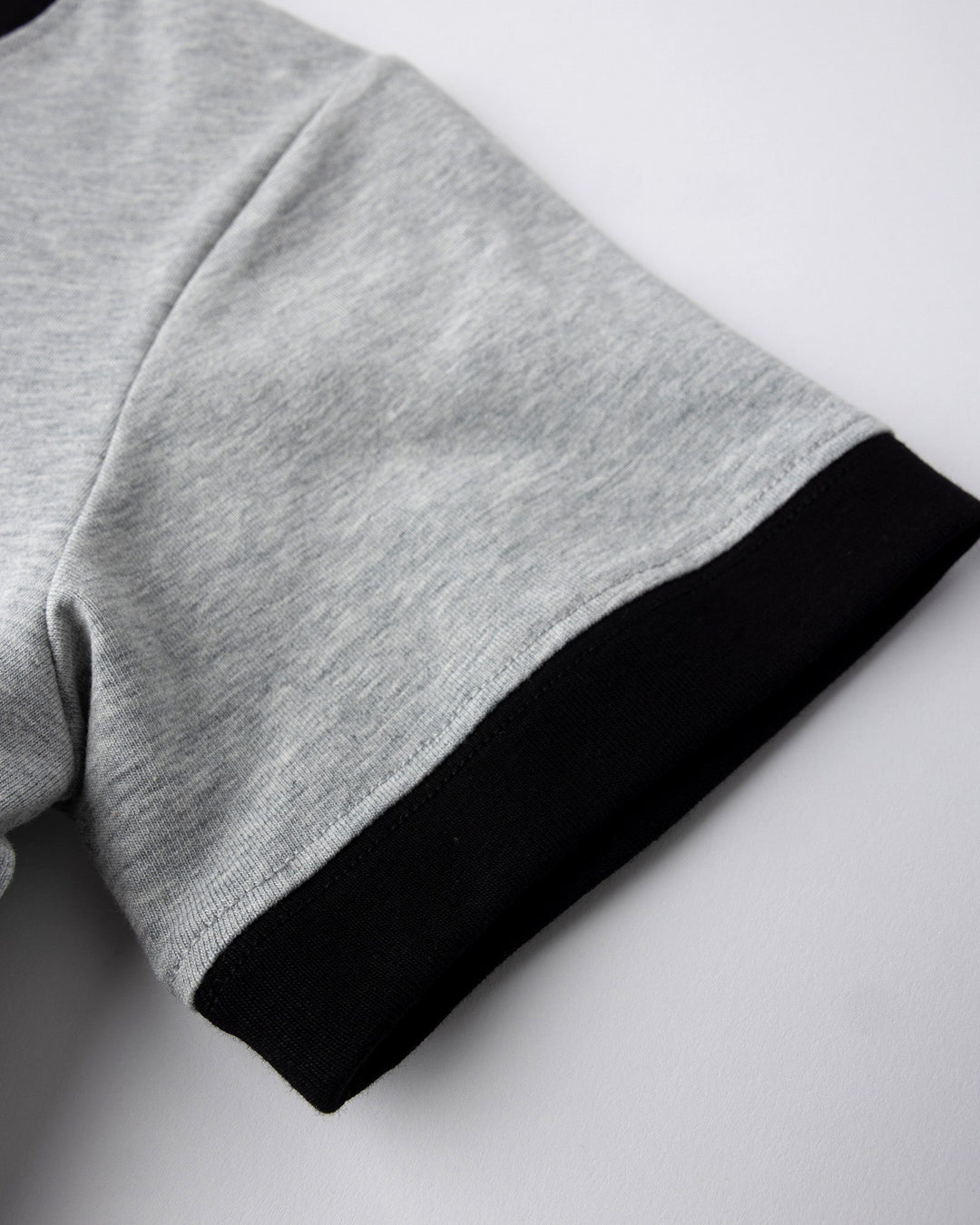 Close up detail of the Hello Skull Tee in grey marle and black