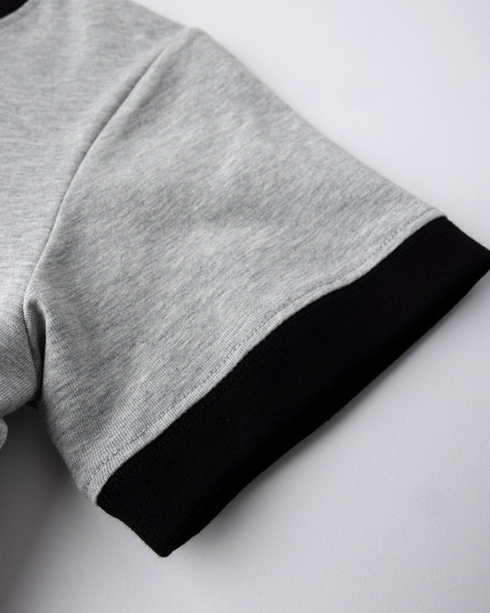 Close up detail of the Hello Skull Tee in grey marle and black