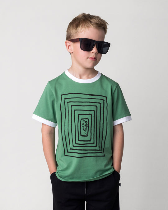Close up of the Hidden Panda Tee in turf and white on a kid, front view