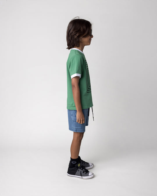 Kid wearing the Hidden Panda Tee in turf and white with the Blasted Deluxe Cargo Short in midnight wash, side view