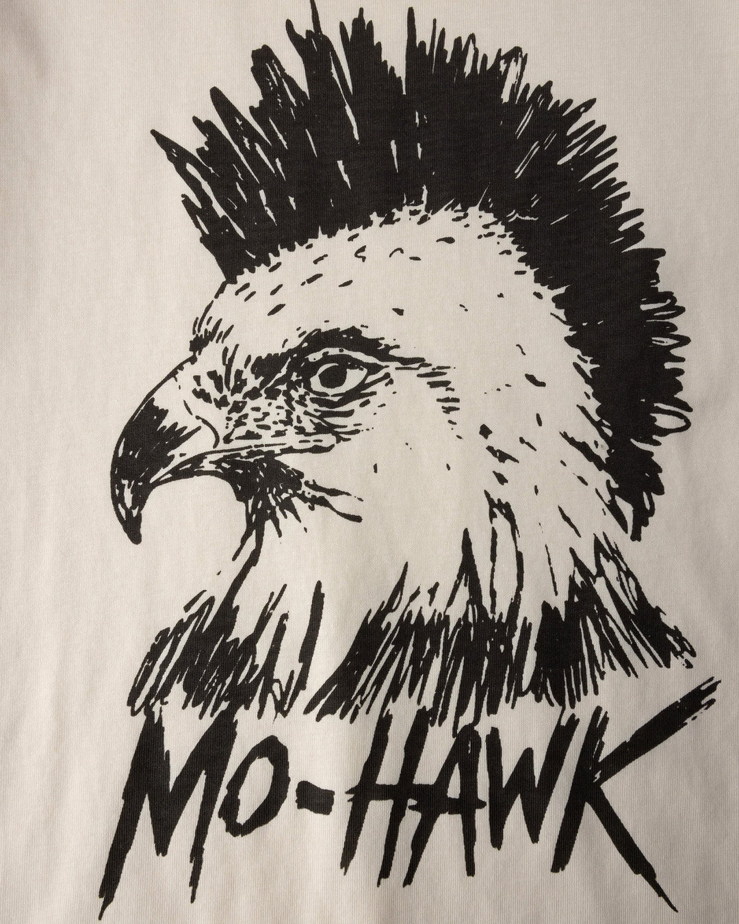 Close up of the Mo-Hawk Tee print in cream and black