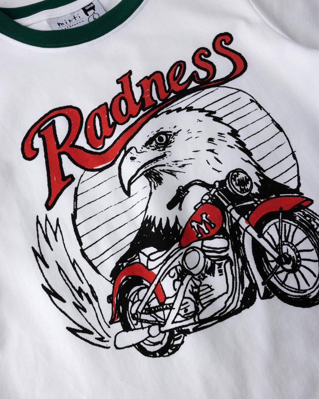 Close up of the Radness Tee print in white and jungle