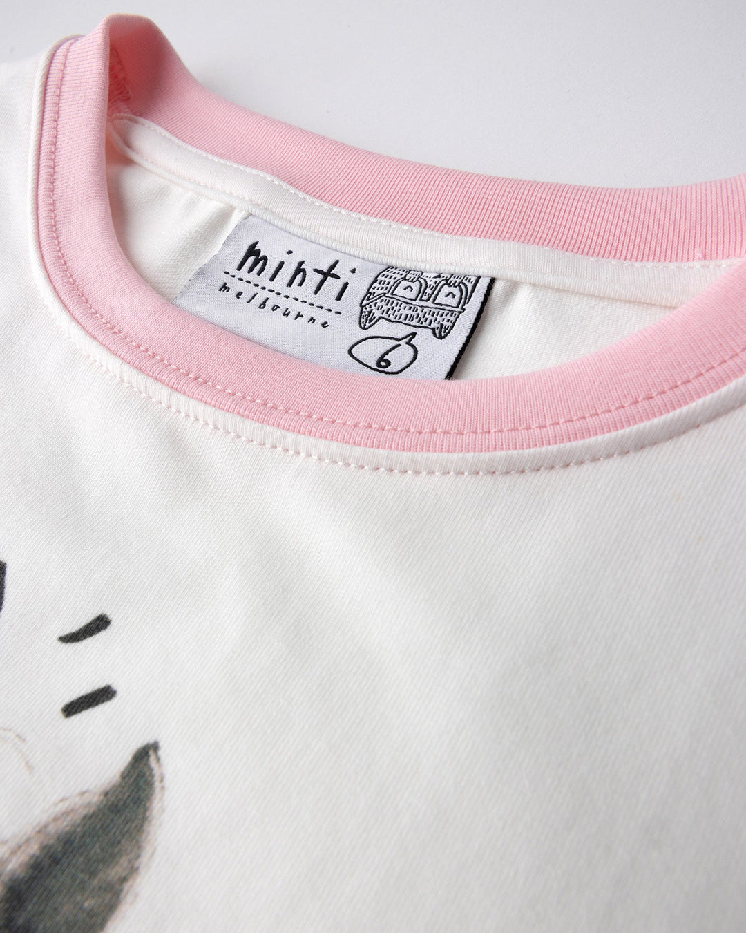 Close up detail of the Watercolour Unicorn Tee in white and pink