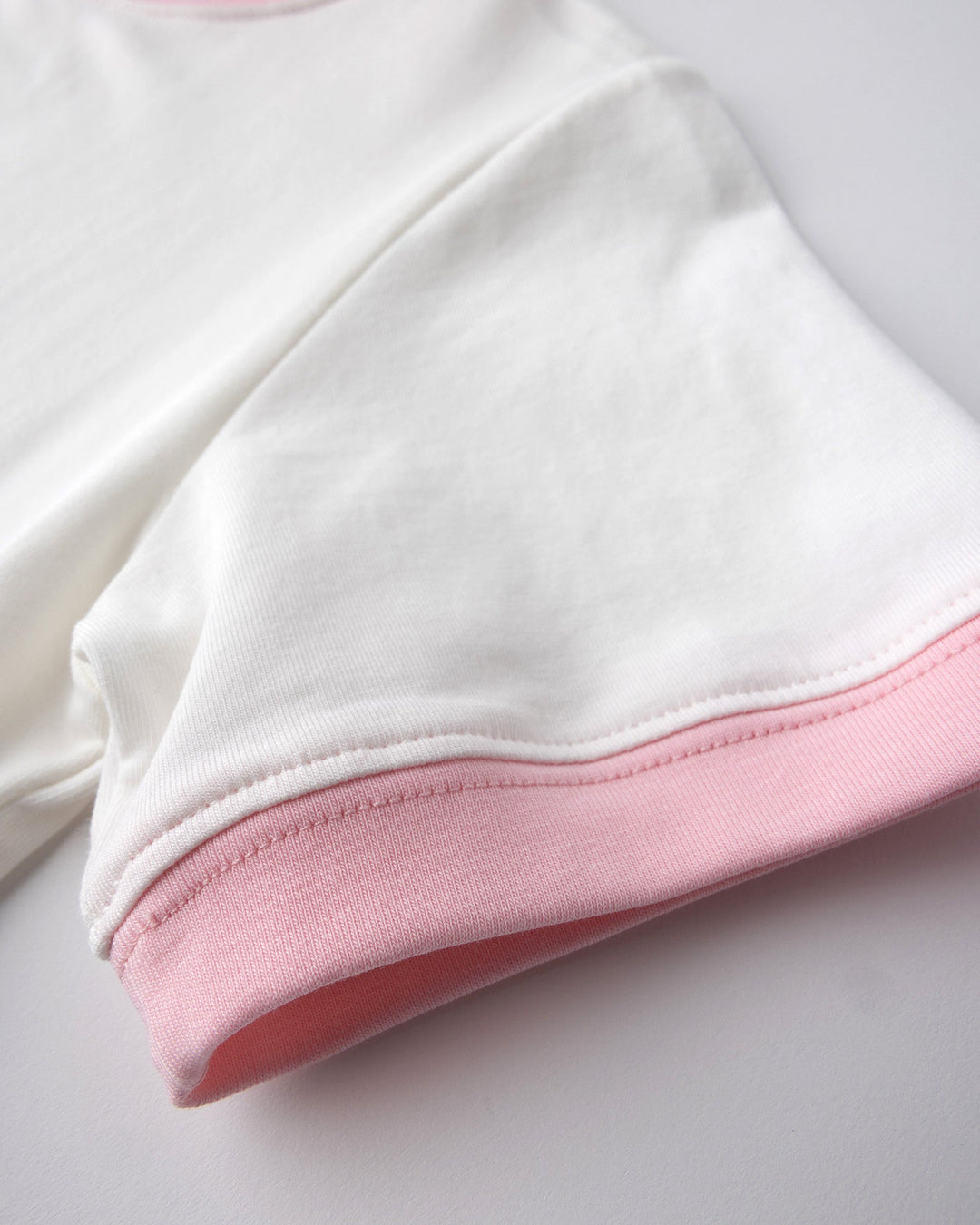 Close up detail of the Watercolour Unicorn Tee in white and pink