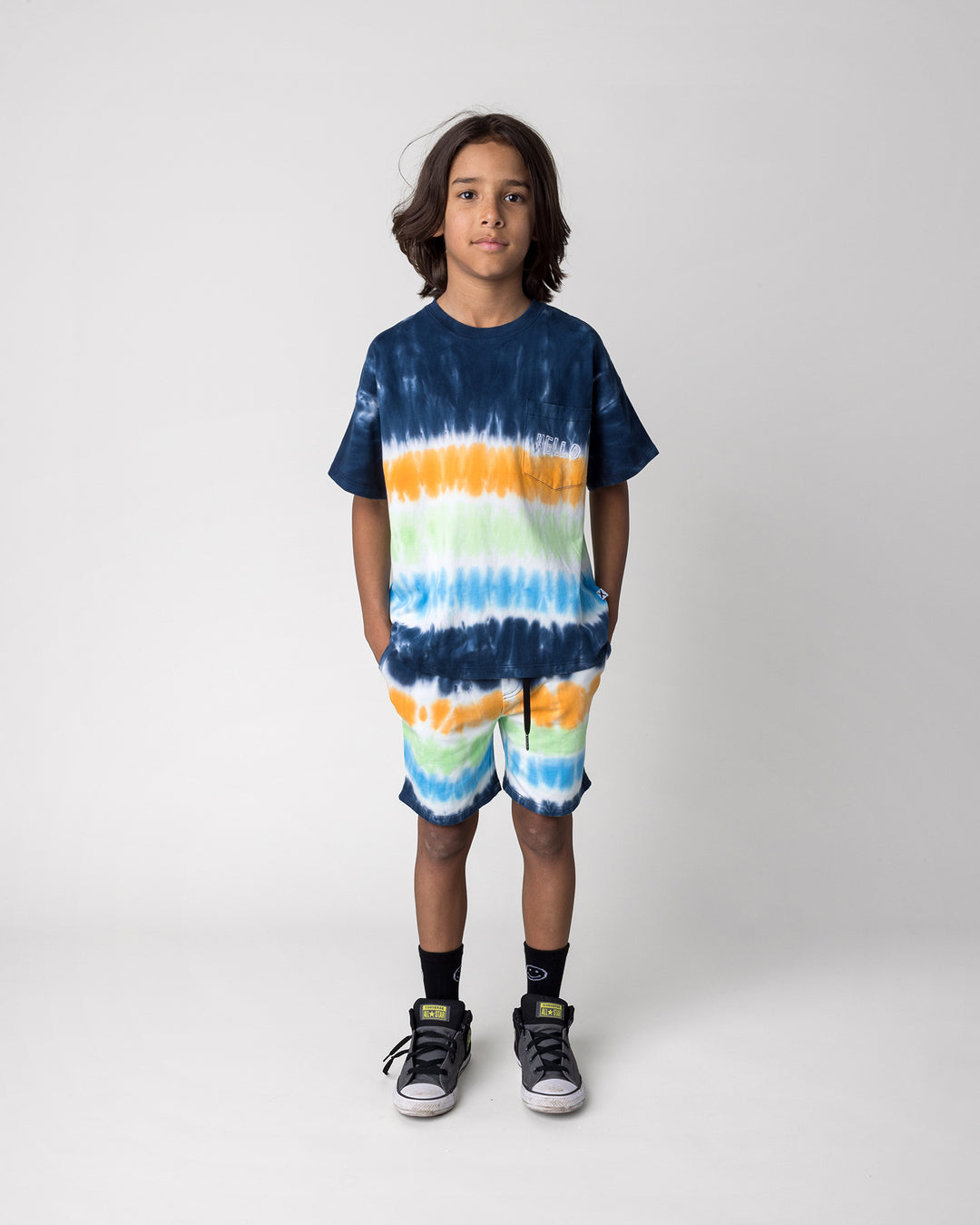 Kid wearing the Airwaves Tee in navy with the Airwaves Short in navy, front view