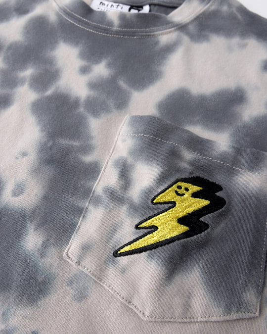 Close up detail of the Splatter Tee in grey