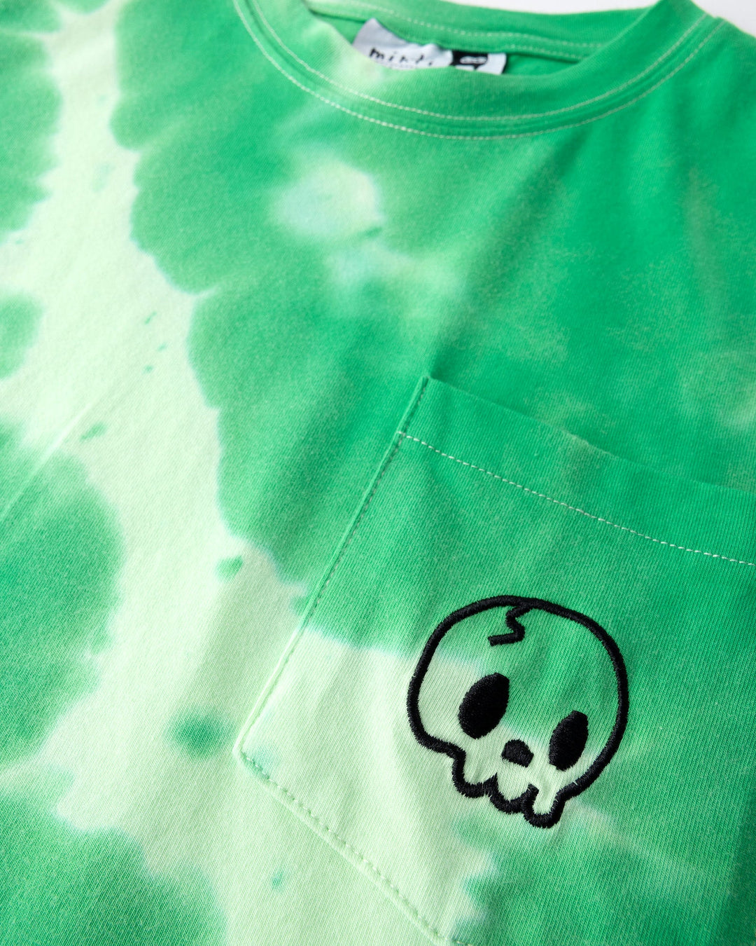 Close up detail of the Splatter Tee in green
