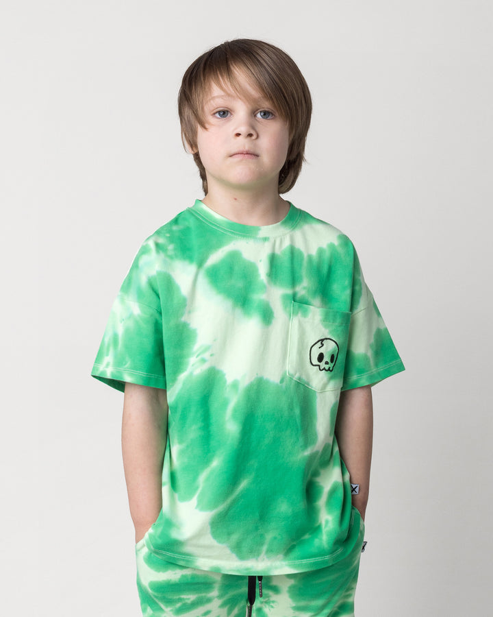 Close up of the Splatter Tee in green on a kid, front view