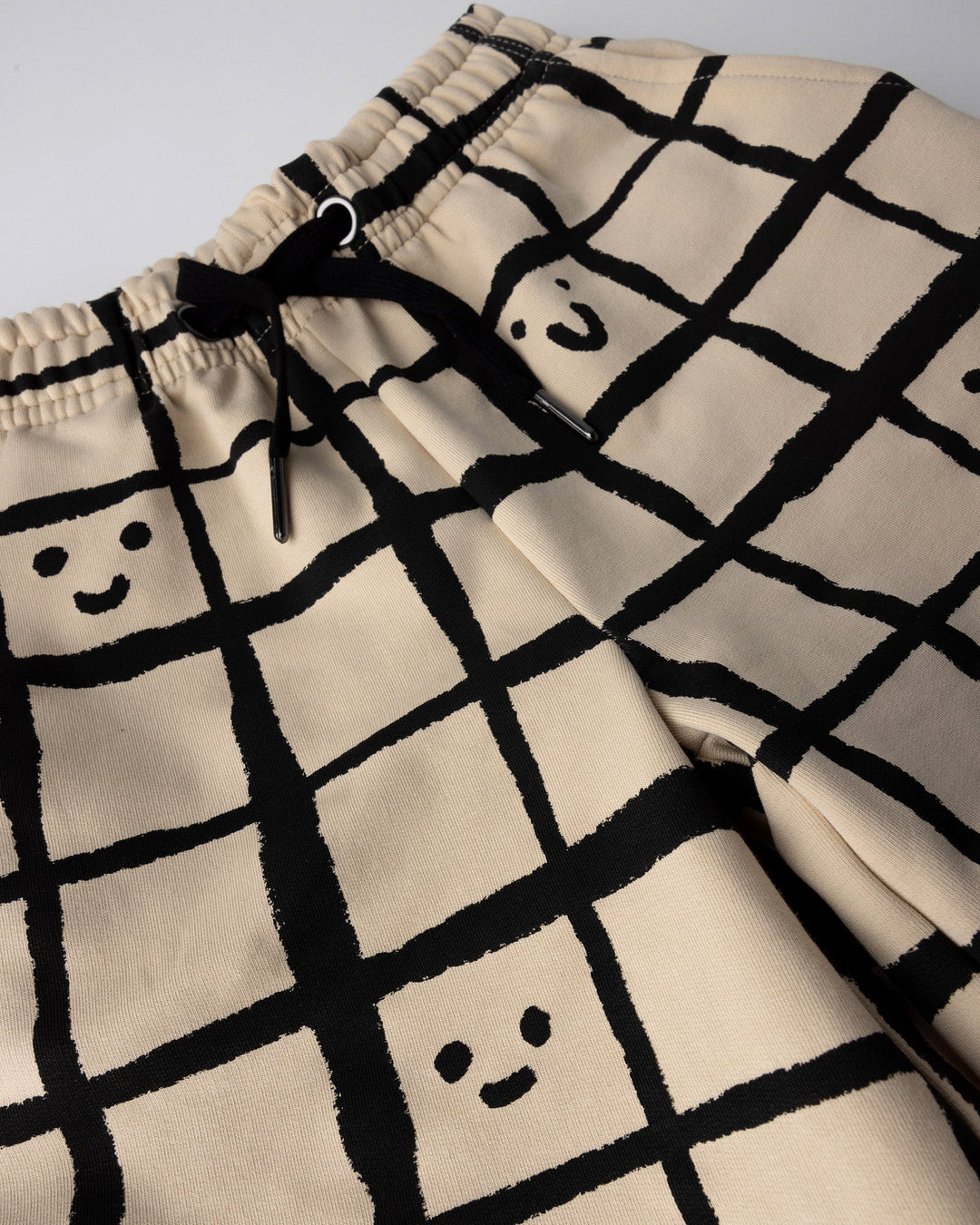 Close up of the Happy Squares Short print in beige