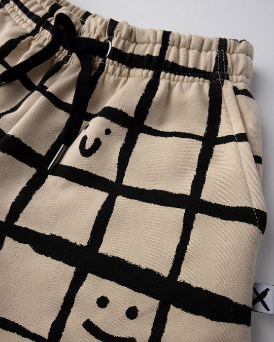 Close up of the Happy Squares Short print in beige