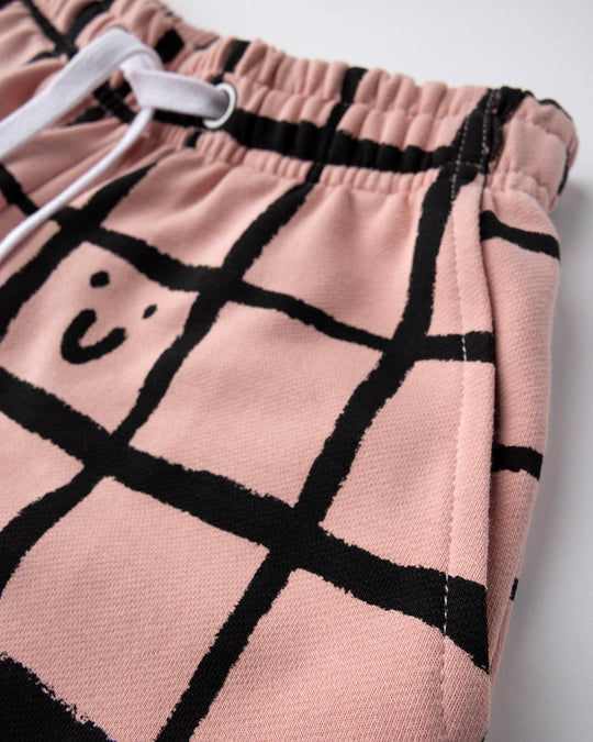 Close up of the Happy Squares Short print in dusty pink