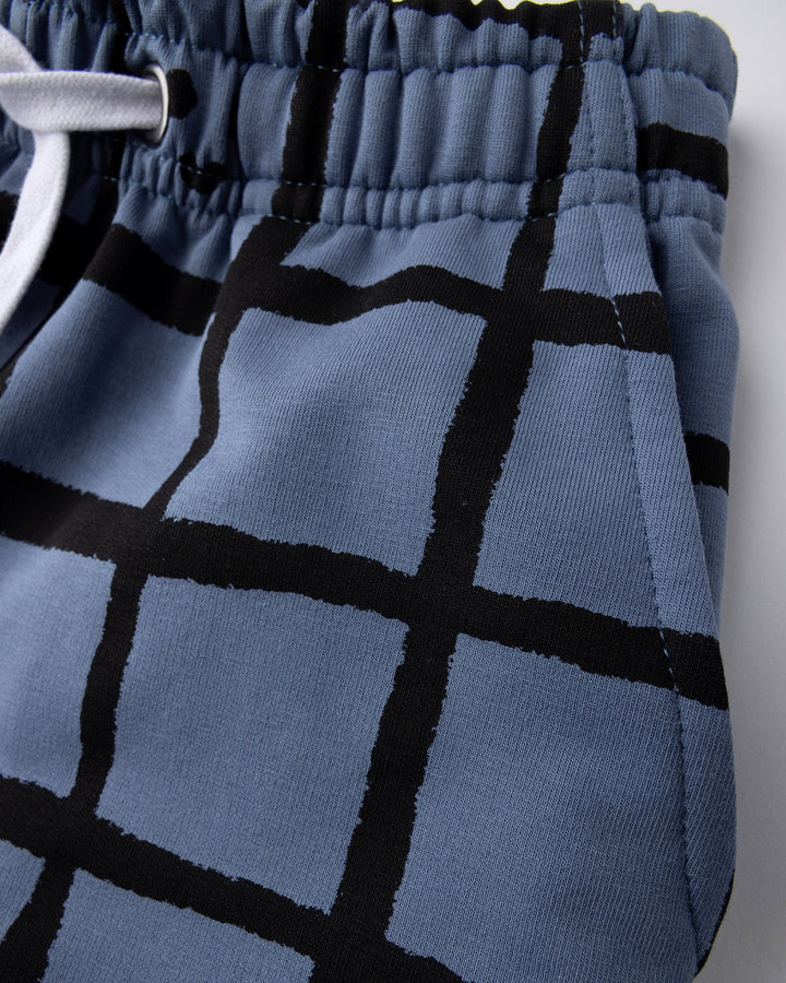 Close up detail of the Happy Squares Short in muted blue
