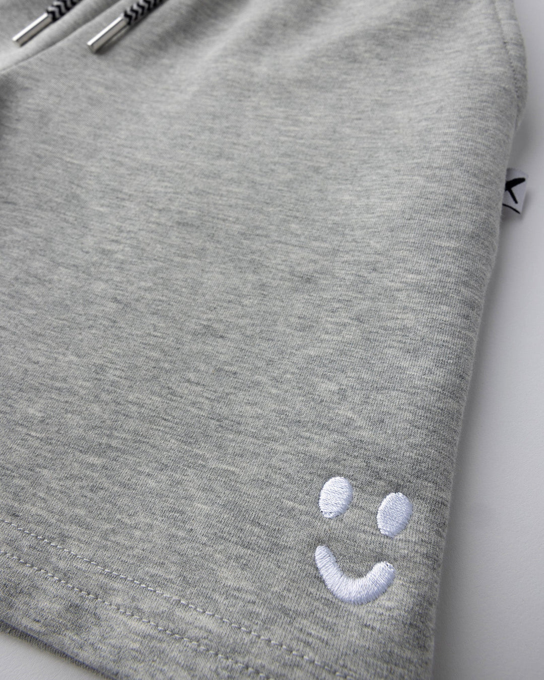 Close up detail of the Smile Short in grey marle