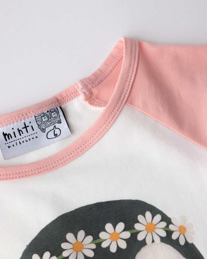 Close up detail of the Flower Penguin Tee in white and pink