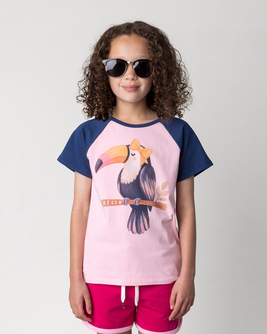 Close up of the Hello Toucan Tee in ballet and ink on a kid, front view