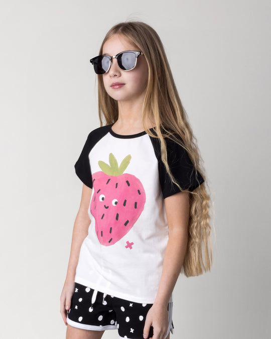 Close up of the Happy Strawberry Tee in white and black on a kid, front view
