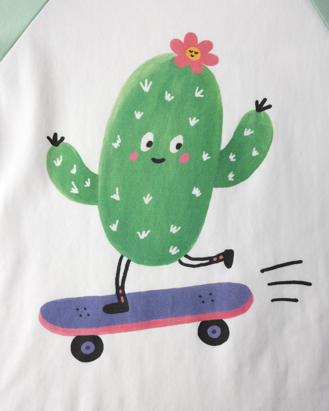 Close up of the Skate Cactus Tee print in white and mint