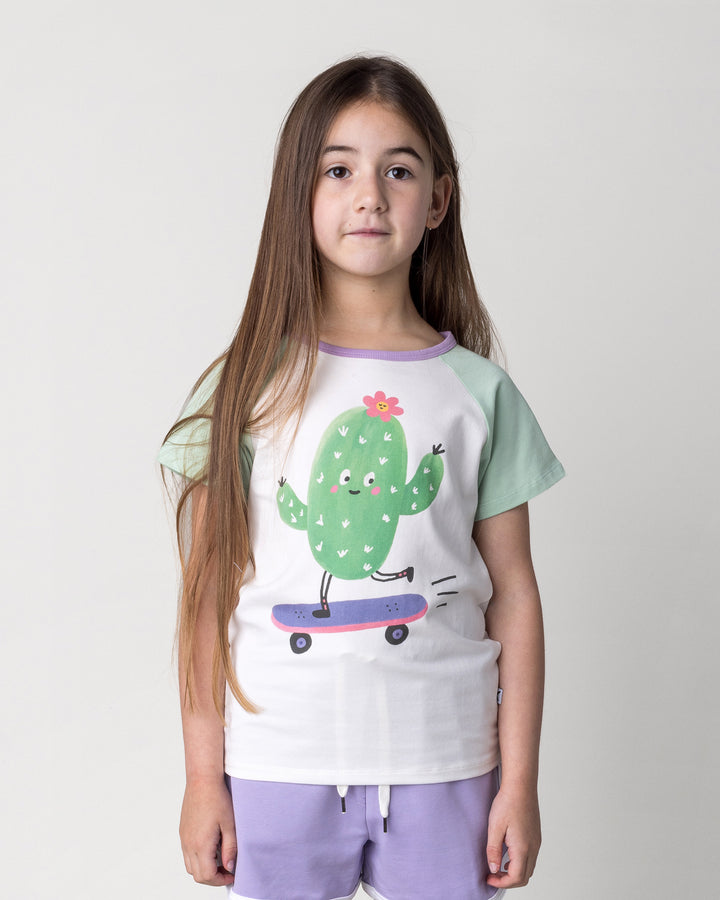 Close up of the Skate Cactus Tee in white and mint on a kid, front view