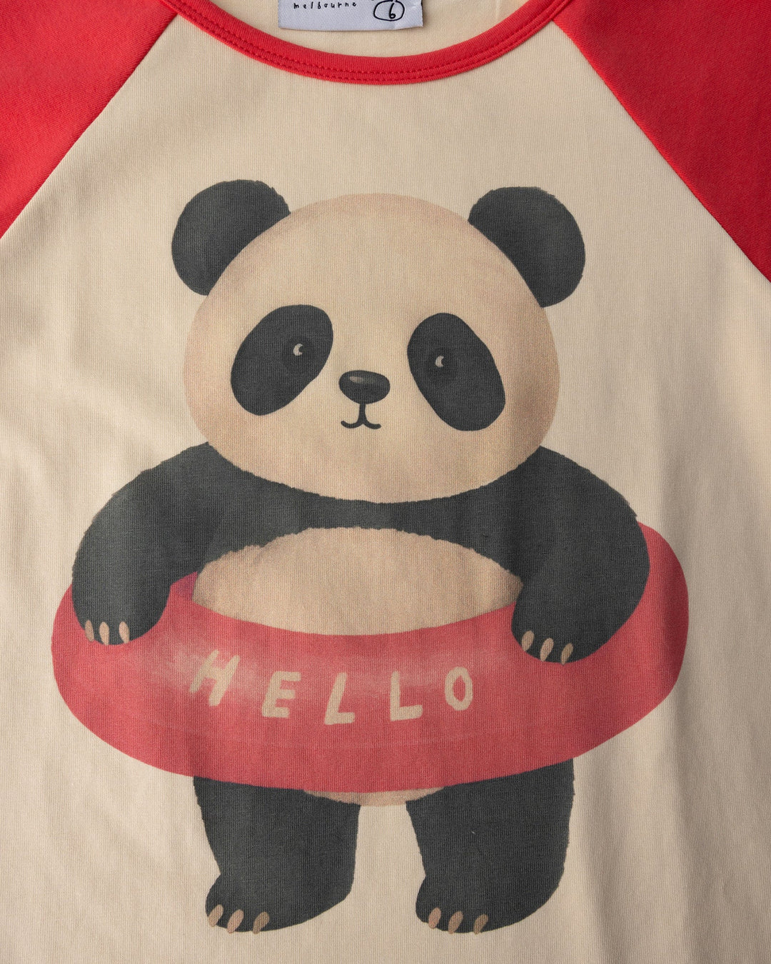 Close up of the Swimming Panda Tee print in stone and watermelon