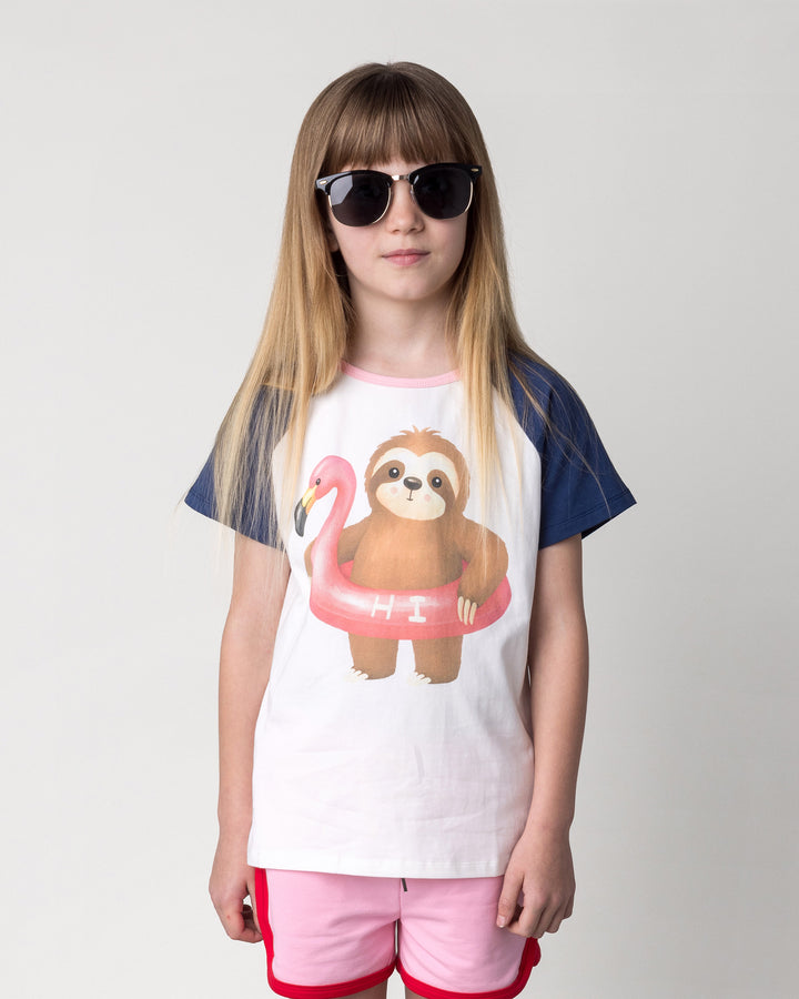 Close up of the Swimming Sloth Tee in white, ink and pink on a kid, front view