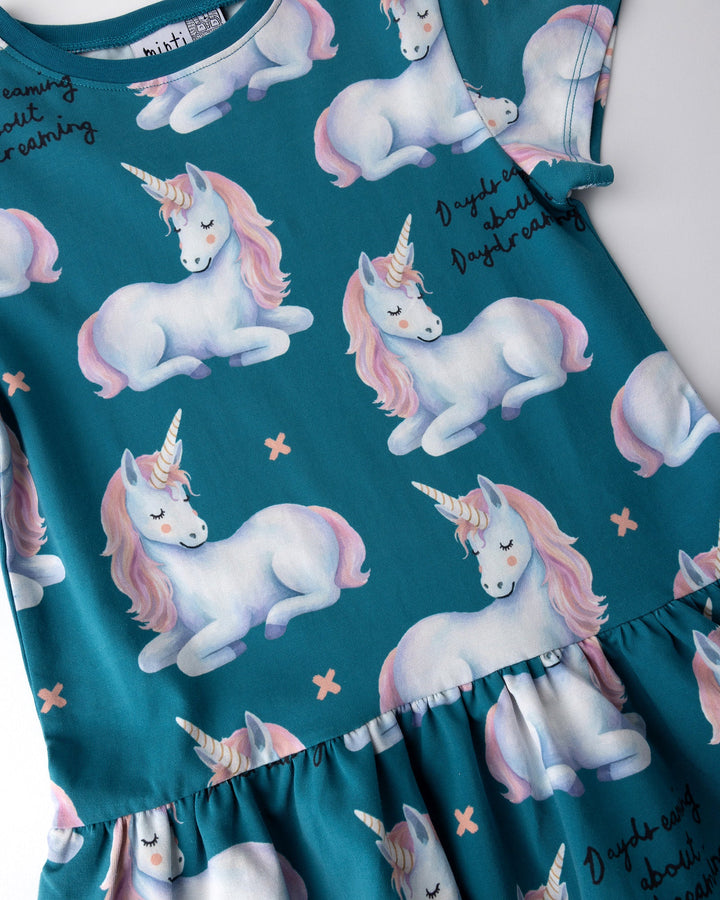 Close up of the Daydreaming Unicorn Dress print in teal