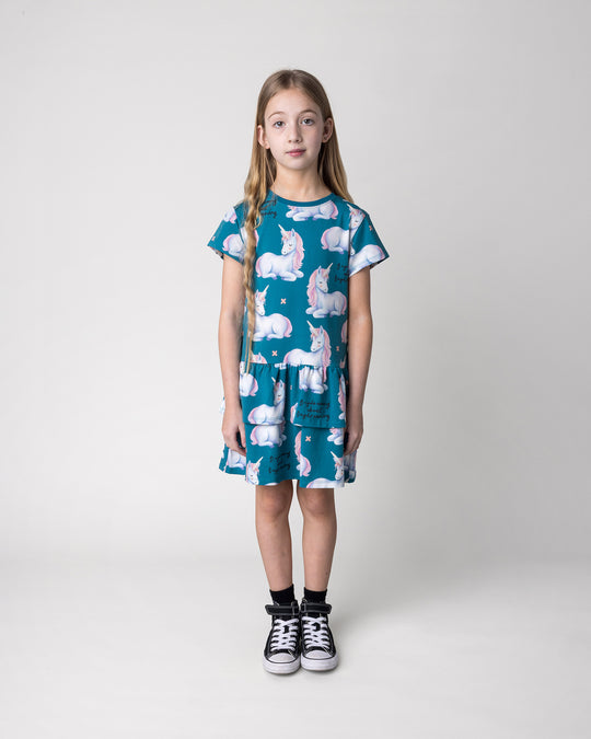 Kid wearing the Daydreaming Unicorn Dress in teal, front view