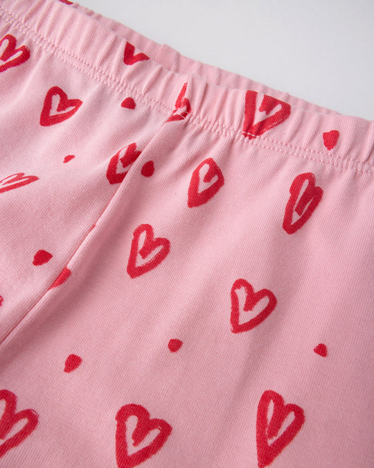 Close up of the Hearts Tights print in pink