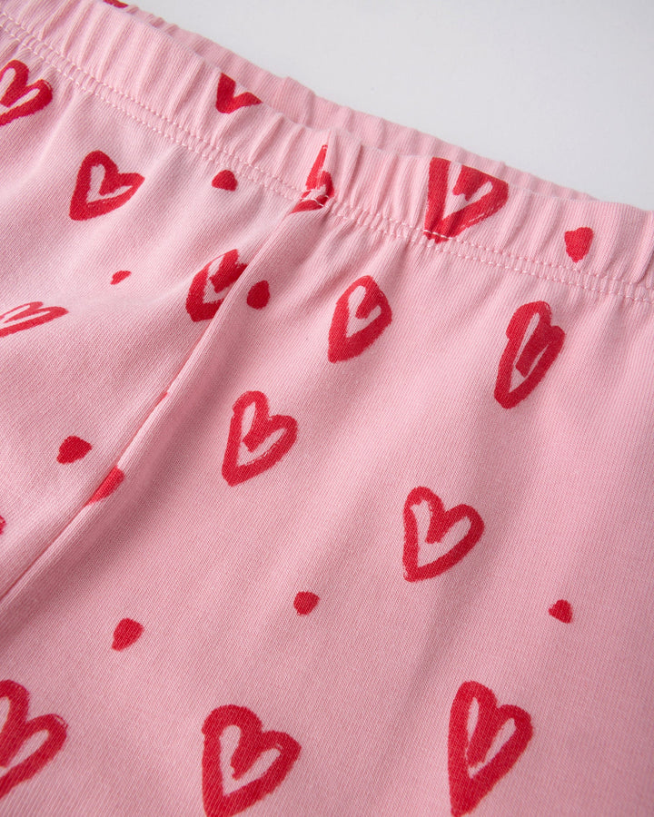 Close up of the Hearts Tights print in pink