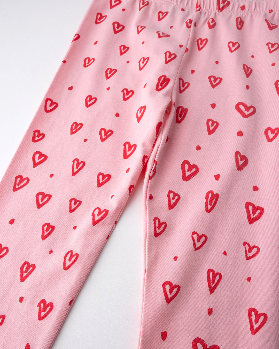 Close up of the Hearts Tights print in pink