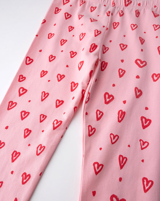 Close up of the Hearts Tights print in pink