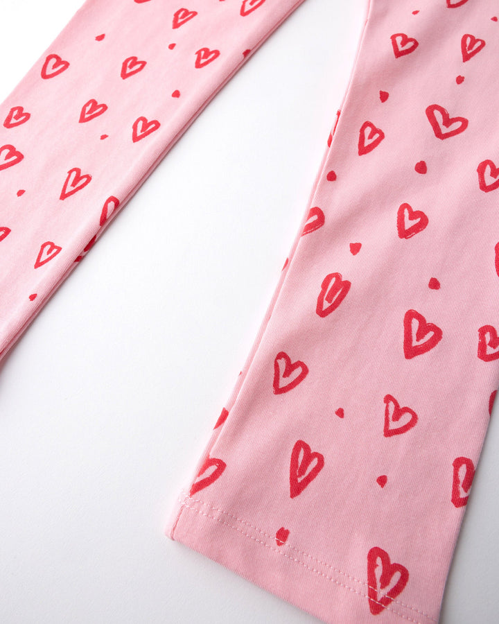 Close up of the Hearts Tights print in pink