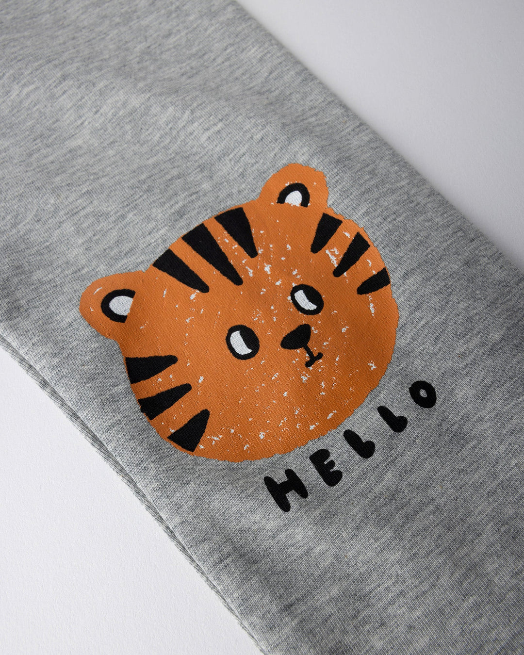 Close up of the Hello Tiger Tights print in grey marle