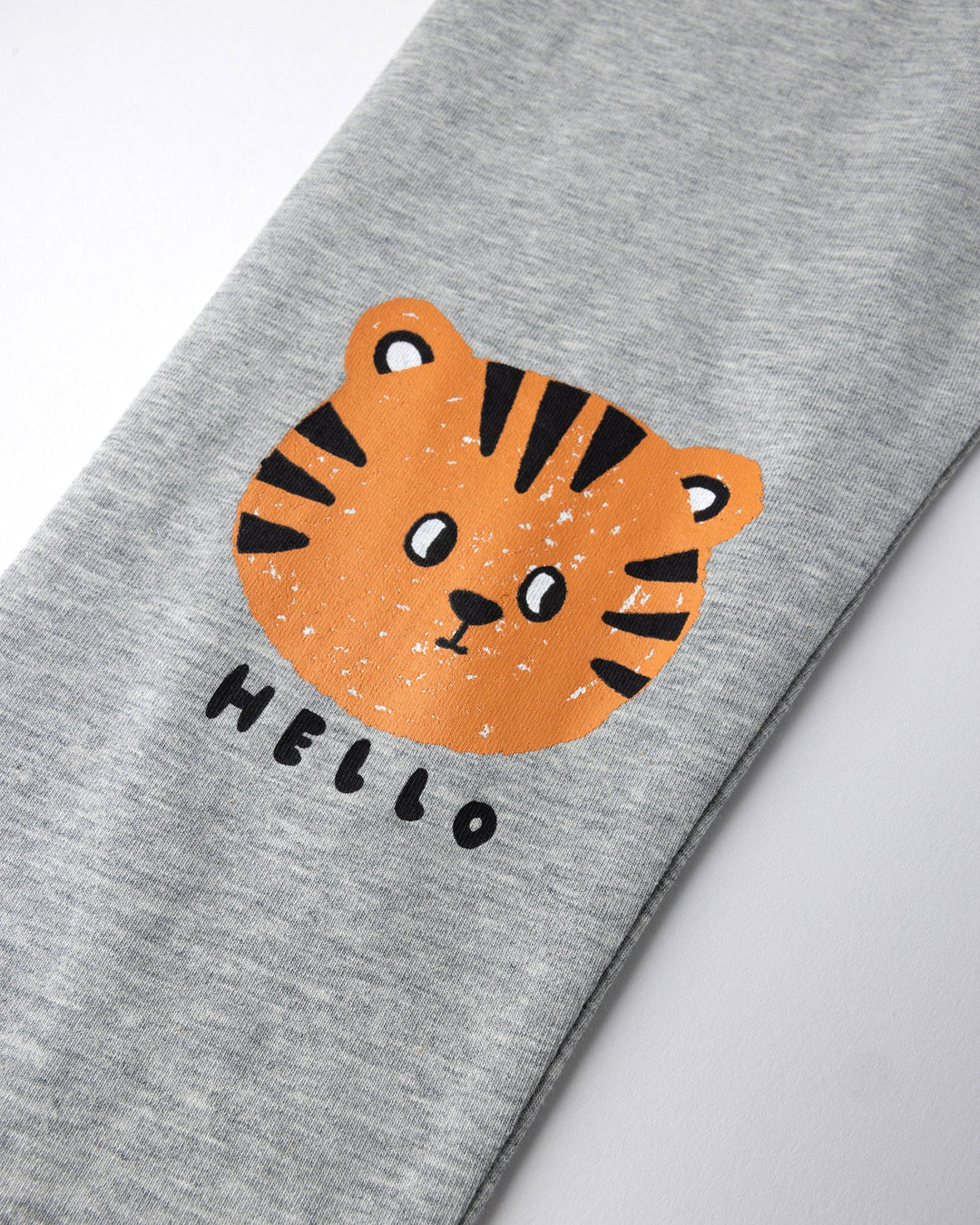 Close up of the Hello Tiger Tights print in grey marle