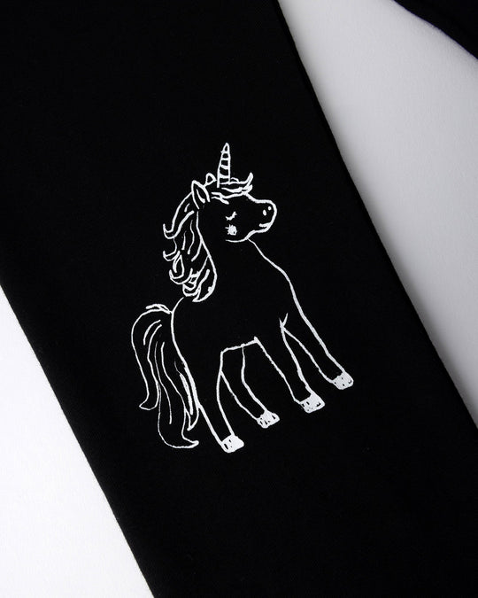 Close up of the Hello Unicorn Tights print in black