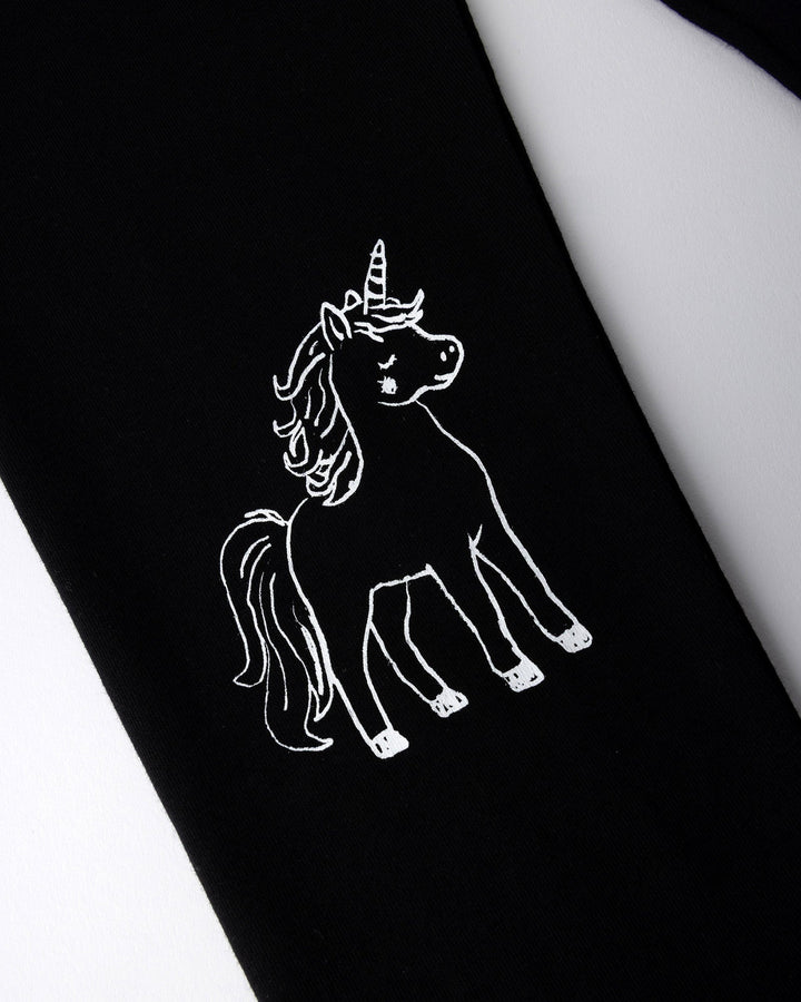 Close up of the Hello Unicorn Tights print in black