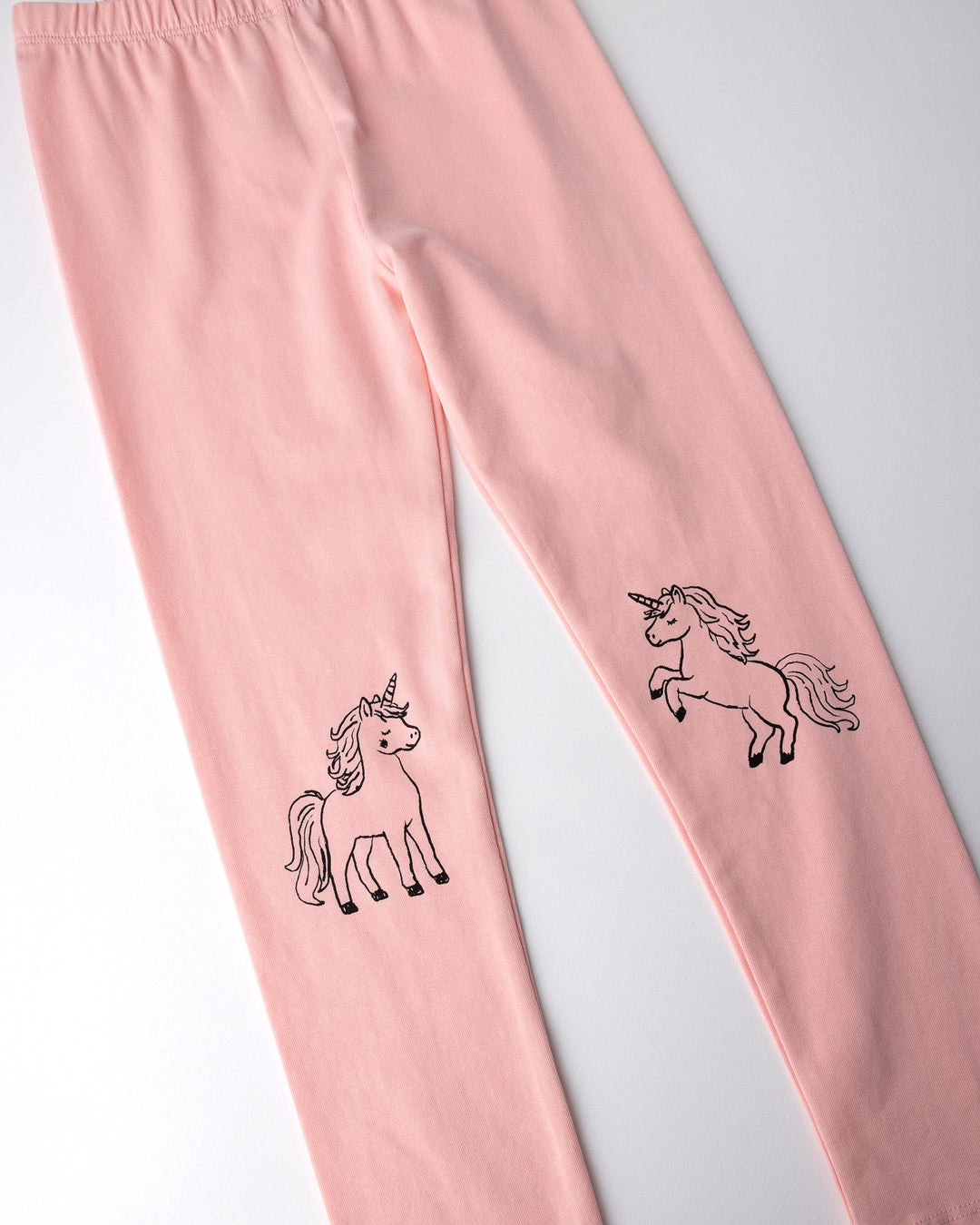 Close up of the Hello Unicorn Tights print in pink