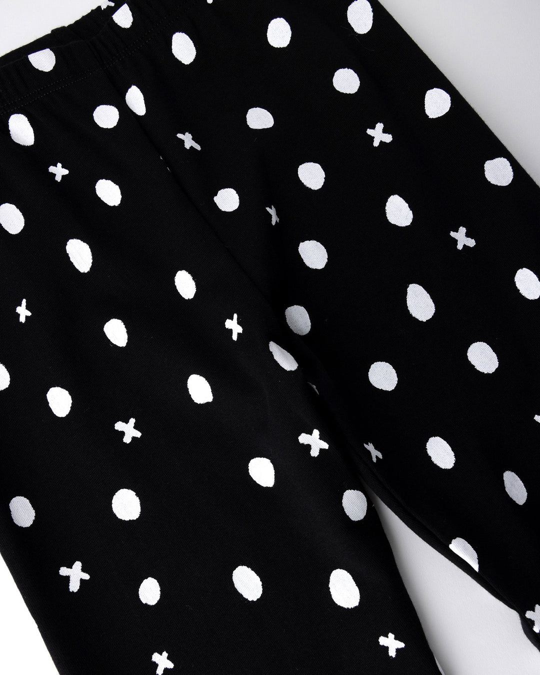 Close up of the Spotty Tights print in black