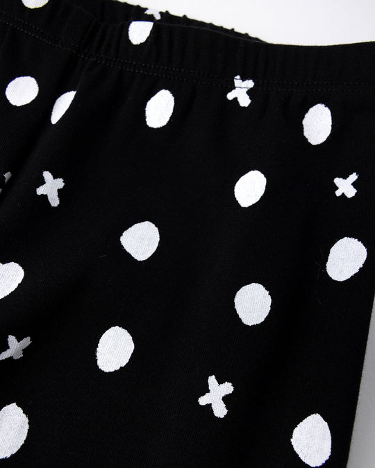 Close up of the Spotty Tights print in black