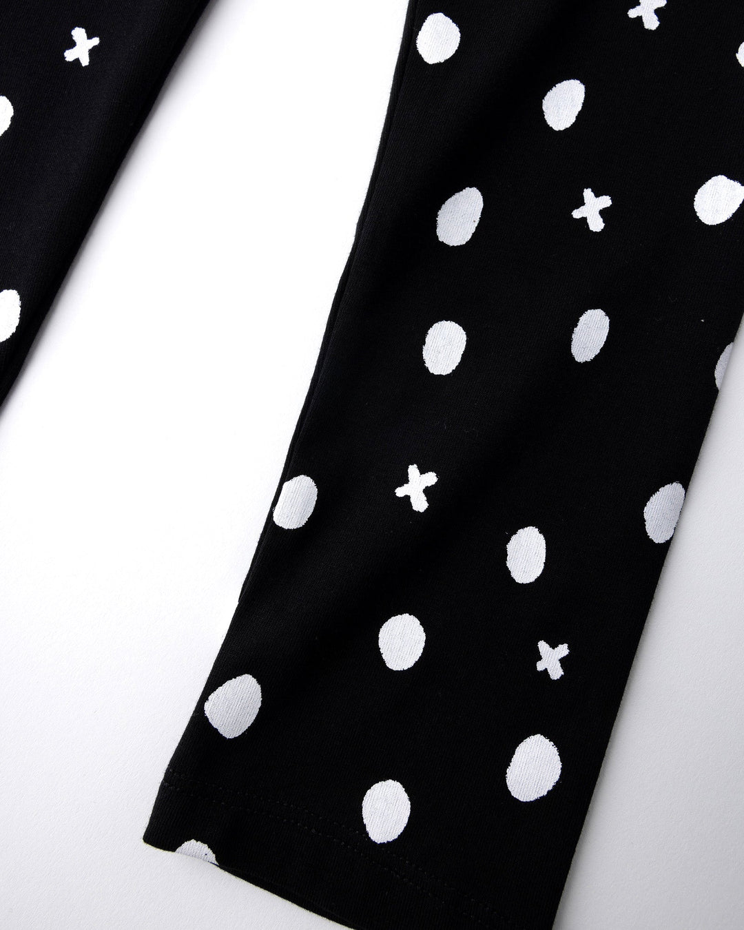 Close up of the Spotty Tights print in black