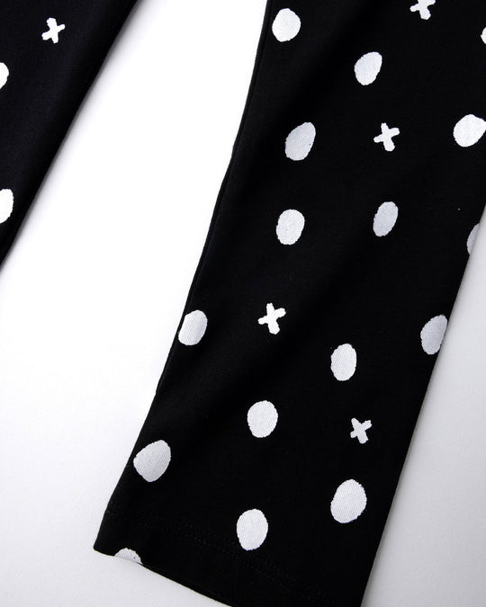 Close up of the Spotty Tights print in black