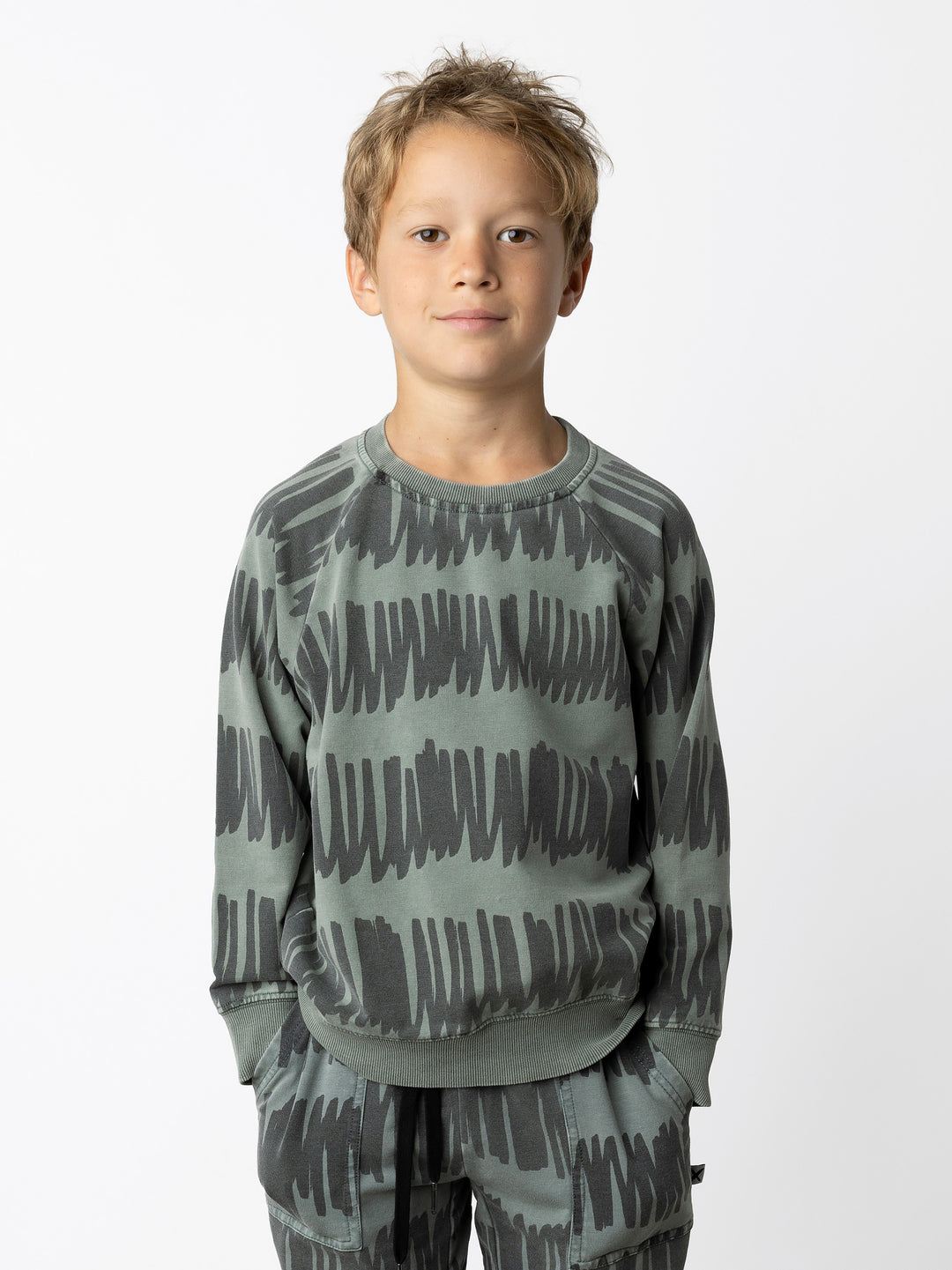 Minti kids clothing. Comfy lightweight raglan crew in super cool washed terry. 260 Gram // 95% Cotton // 5% Elastane.