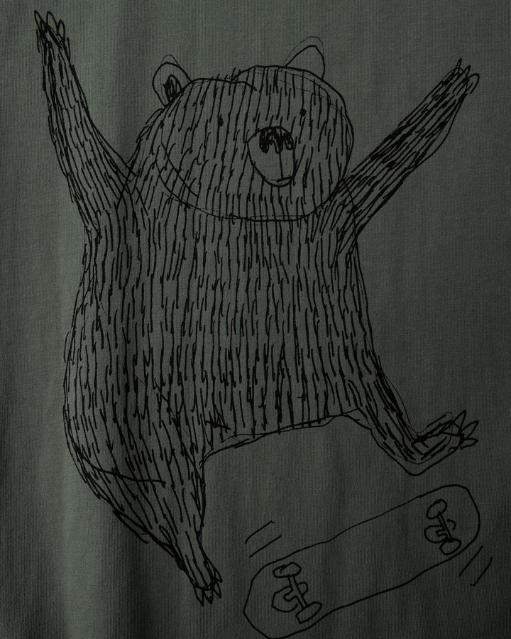 Close up of the Boarding Bear Tee print in forest, dark grey and yellow