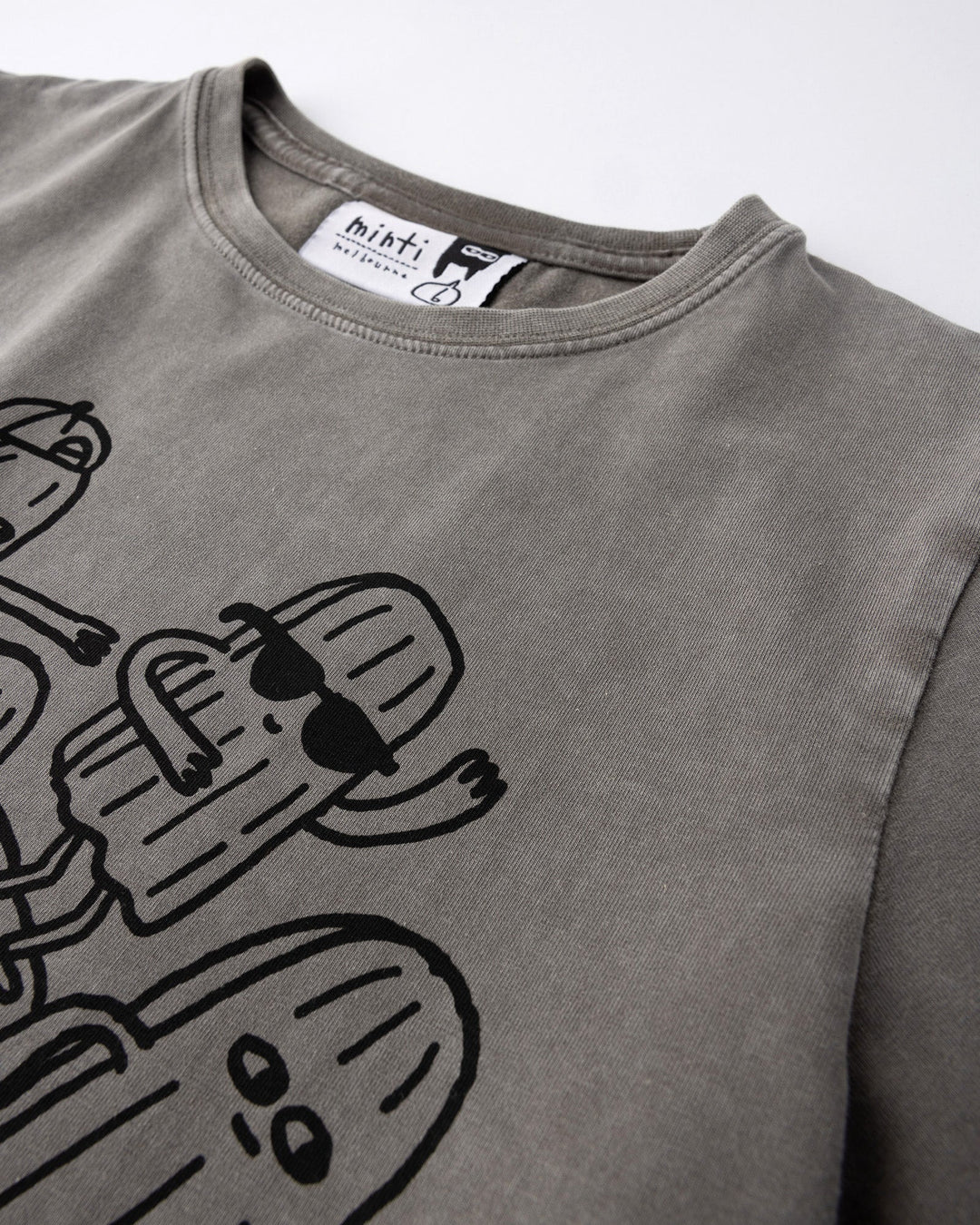 Close up of the Cool Crew Tee print in grey wash