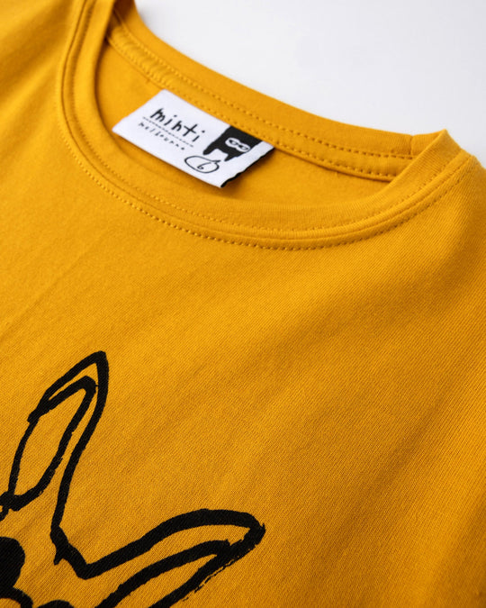 Close up of the Chill Mates Tee print in mustard